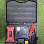 Portable multi-function car jump starter kit with an integrated air compressor